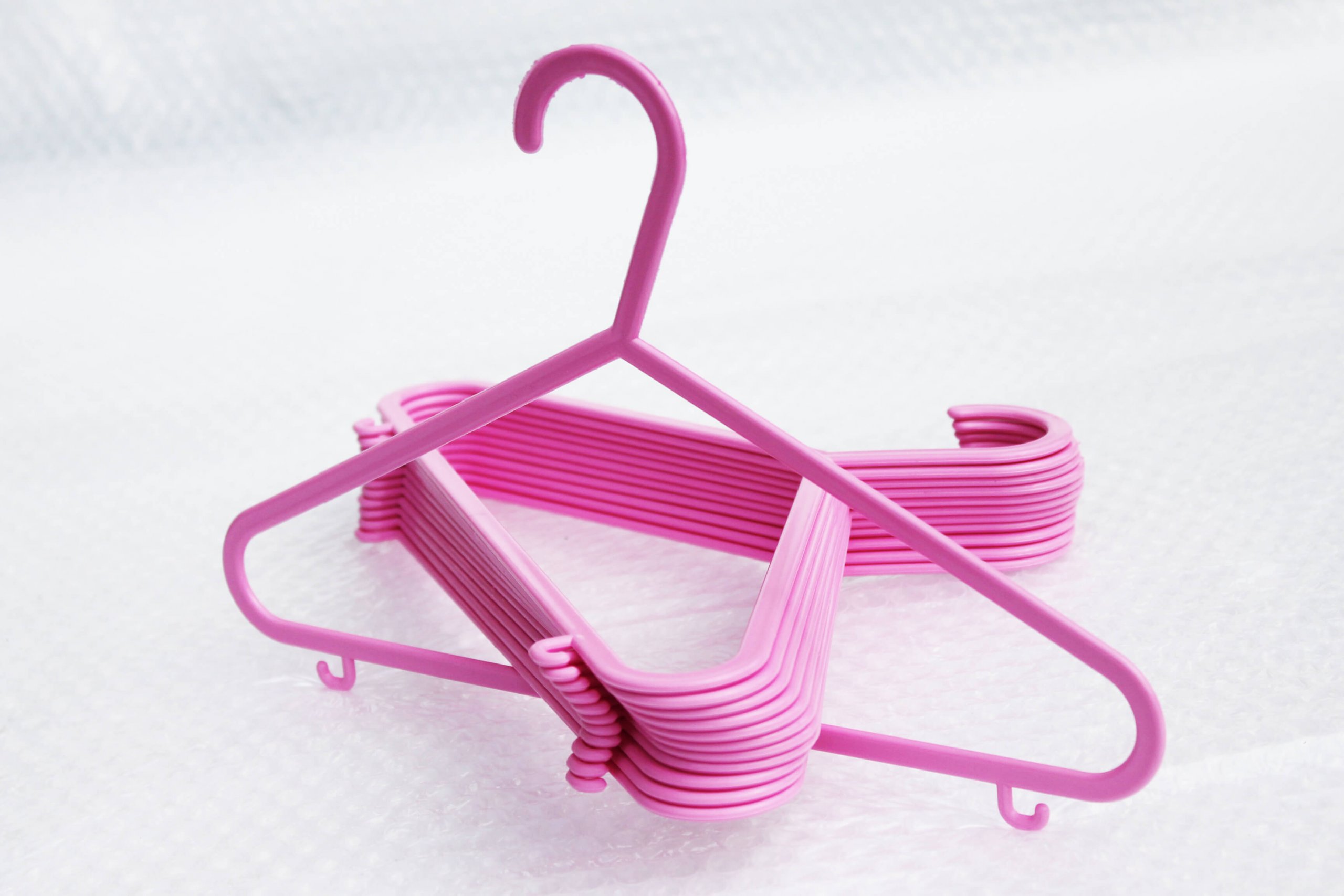 Baby kids Coloured Hangers with Trouser Bar Hooks in Pink & Blue HangersRus 